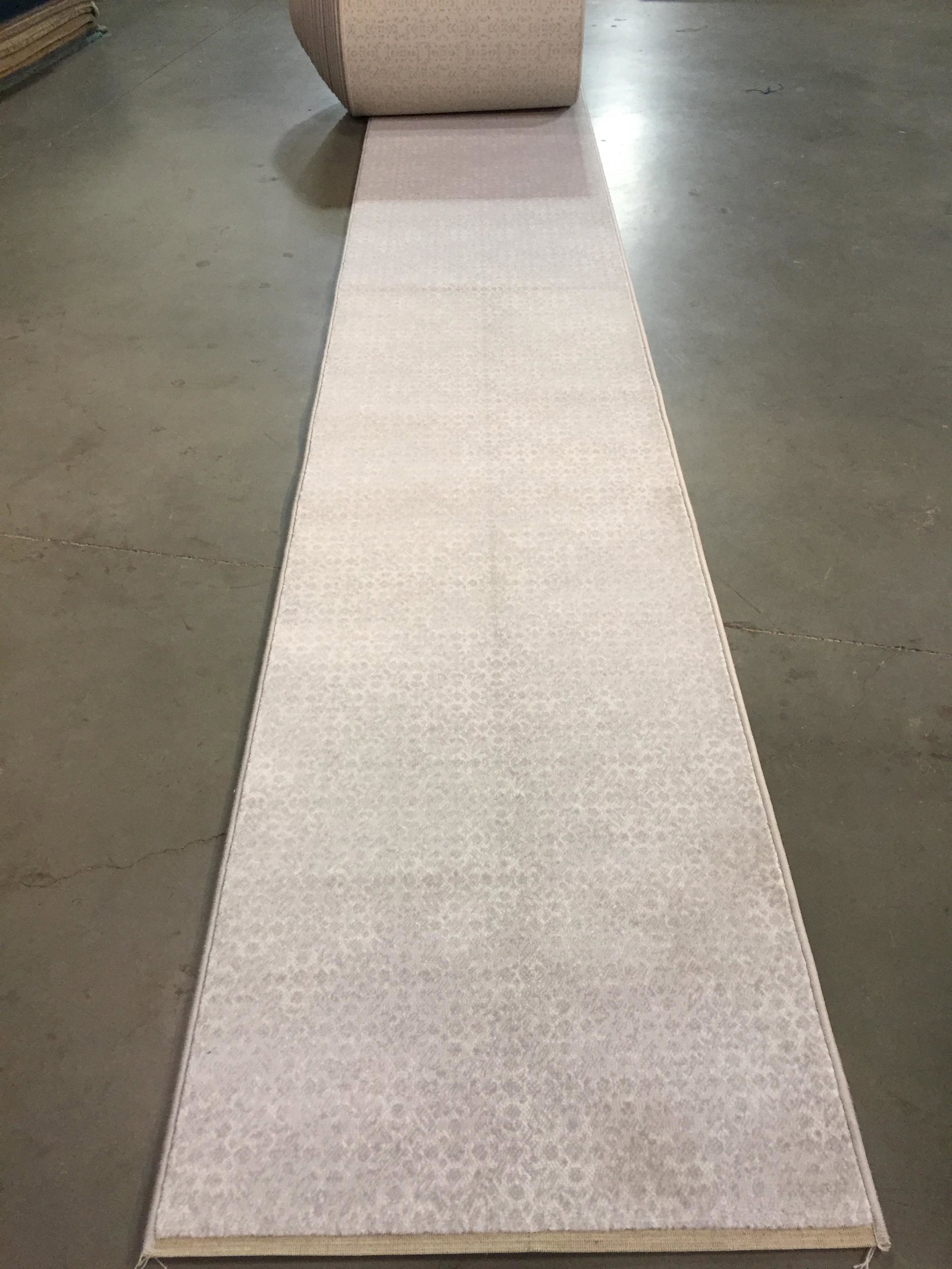 35 ft Long stair/hallway Belgium roll runner: 27 inchs wide Premium Quality Belgium roll runner 37 ft long Texture imprint in Grey, Ivory colors Stain resistant , dence polypropylen pile made in Belgium