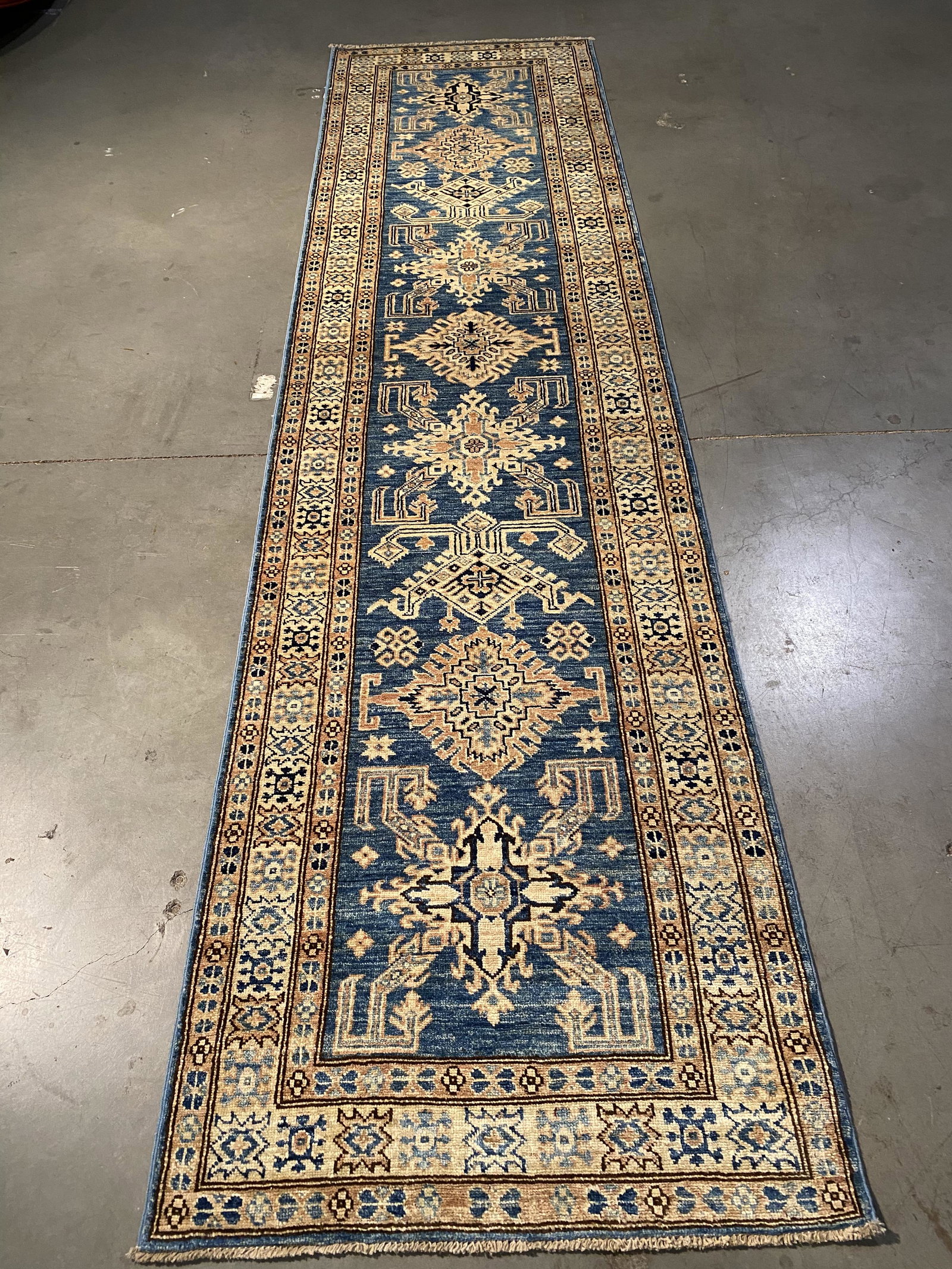 EXQUISITE FINE SUPER KAZAK RUNNER 2.8x10.7: 2.8x10.7 Fine Authentic Hand Knotted 100% Veggie Dye Natural hand spun wool Pile Geometric pattern super quality Kazak runner high sheen in blue and multi accent colors Hand Knotted in Pakistan