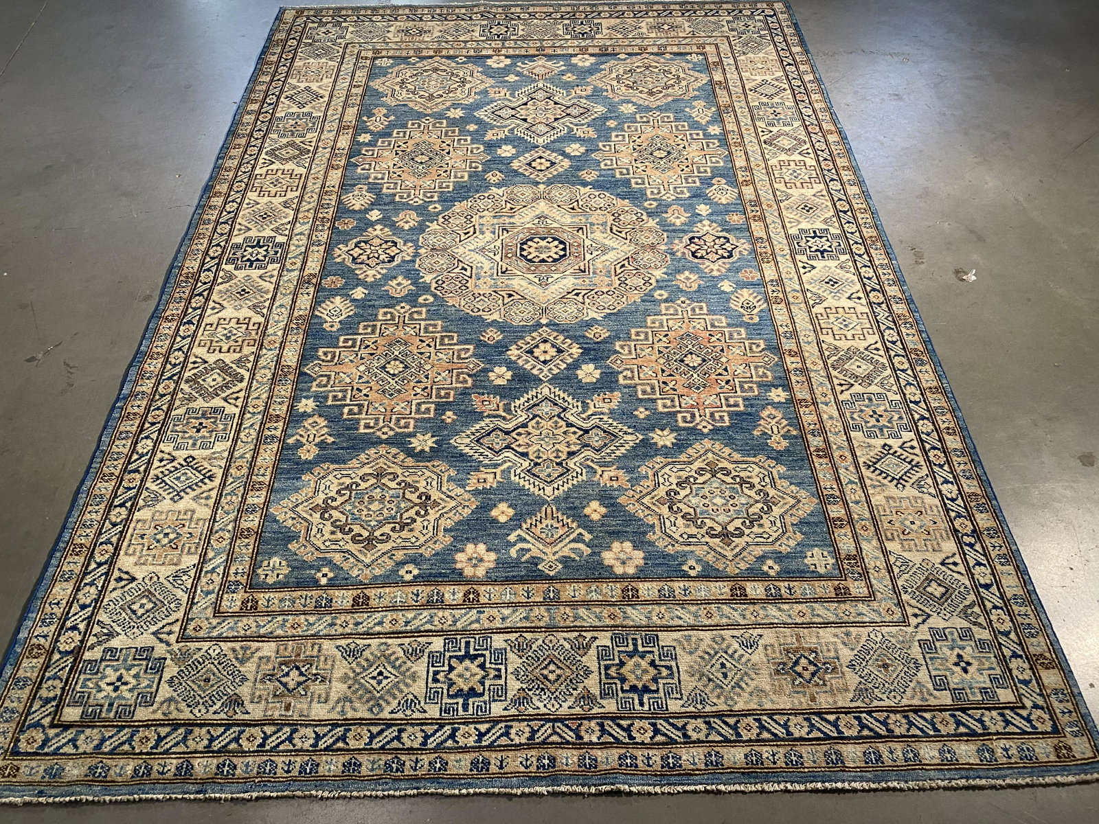 STUNNING FINE KAZAK RUNNER 5.8x8.3: 5.8x8.3 Super quality Unique Tribal design Kazak rug, hand spun and hand knotted rug in Pakistan 100% natural wool with beautiful sheen pile, in blue and multi accent colors