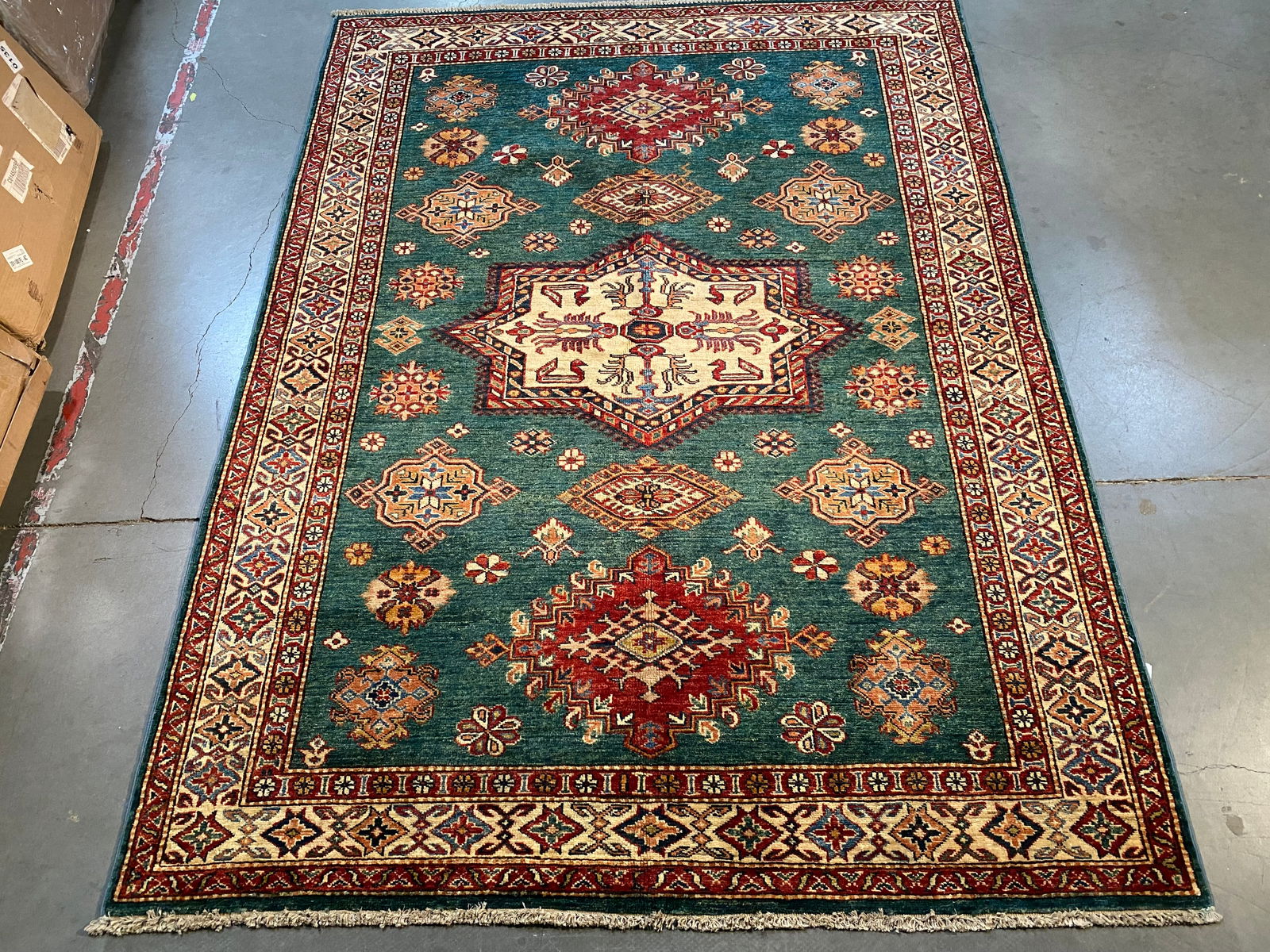 MAGNIFICENT SUPER KAZAK RUG 5' X6'.9": 5' X6'.9" Super quality Kazak Rug, hand spun and hand knotted rug in Pakistan 100% natural Vegge Dye wool, pile, in Green, Ivory and multi accent colors.