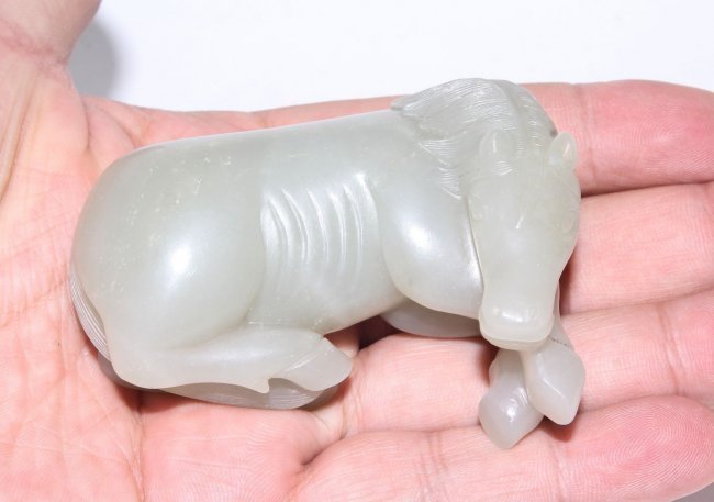 A FINE CARVED HETIAN JADE HORSE, QING DYNASTY (1 of 6)