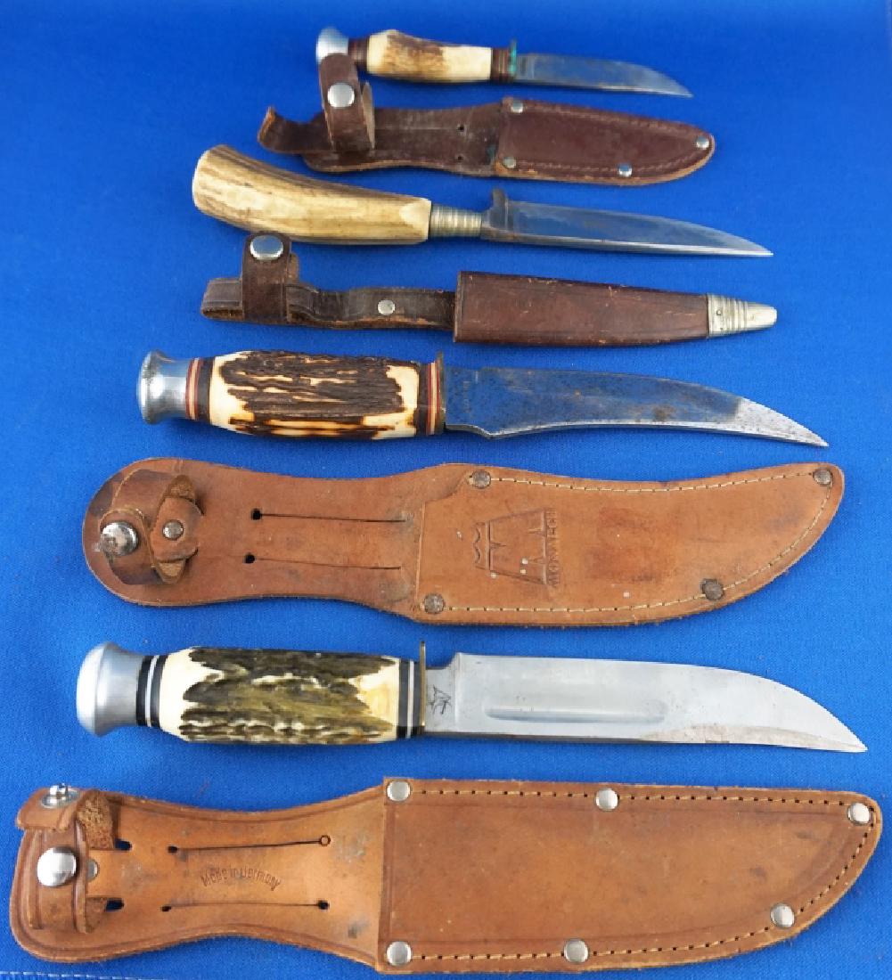 (4) STAG HANDLE BOWIE KNIVES WITH LEATHER SHEATHES: Includes (1) Ideal Shirt Co, (1) Monarch 2151, (1) Arco Solinger and (1) Pic Solinger