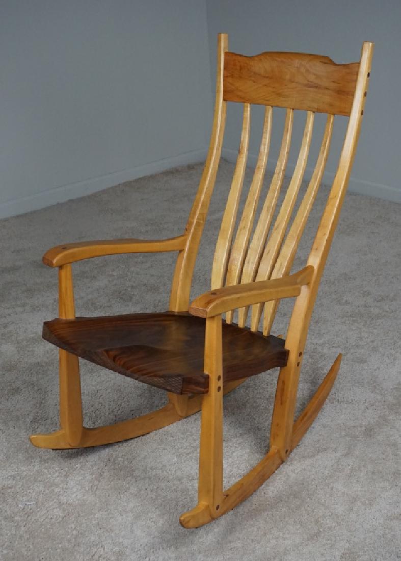 M BARTELL WOODEN ROCKER: 2-tone stain, plank seat, side arms, signed M Bartell, 1992