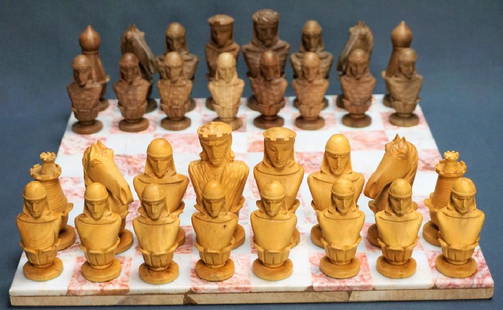 HAND CARVED CHESS SET WITH MARBLE BOARD: HAND CARVED CHESS SET WITH MARBLE BOARD Pink & white marble chess board; Carved light & darker wood pieces; all pieces present; Chess Board: .75"H x 14"square, King" 4"H, Pawn 3"H, wooden box for piec