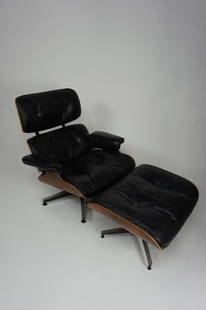 HERMAN MILLER EAMES LOUNGE CHAIR & OTTOMAN: HERMAN MILLER EAMES LOUNGE CHAIR & OTTOMAN Generation 2, produced 1960-1971; Black leather seats; Silver circular cushion clips; down cushions (plus other materials); Adjustable/screw glides to ottoma