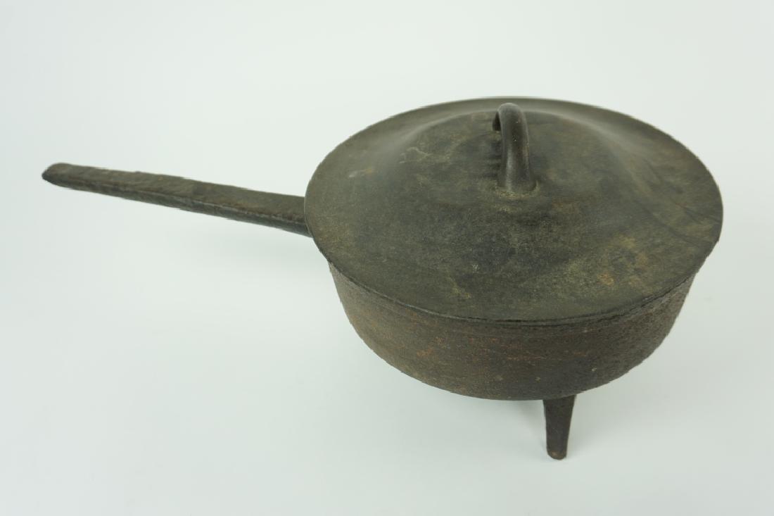 ANTIQUE CAST IRON SPIDER SKILLET WITH LID: ANTIQUE CAST IRON SPIDER SKILLET WITH LID - Lid is marked with star & 7 on underside; 3 legs, heavy solid old piece ; Condition - some rust & patina ; Measures: 7.25"H x 10" diameter