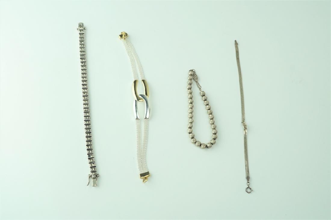 (4) SILVER BRACELETS INCLUDING STERLING: (4) SILVER BRACELETS INCLUDING STERLING Includes a Sterling beaded bracelet with fish hook clasp, Sterling herringbone with springring clasp, a Sterling rectangular linked bracelet with bracelet clasp