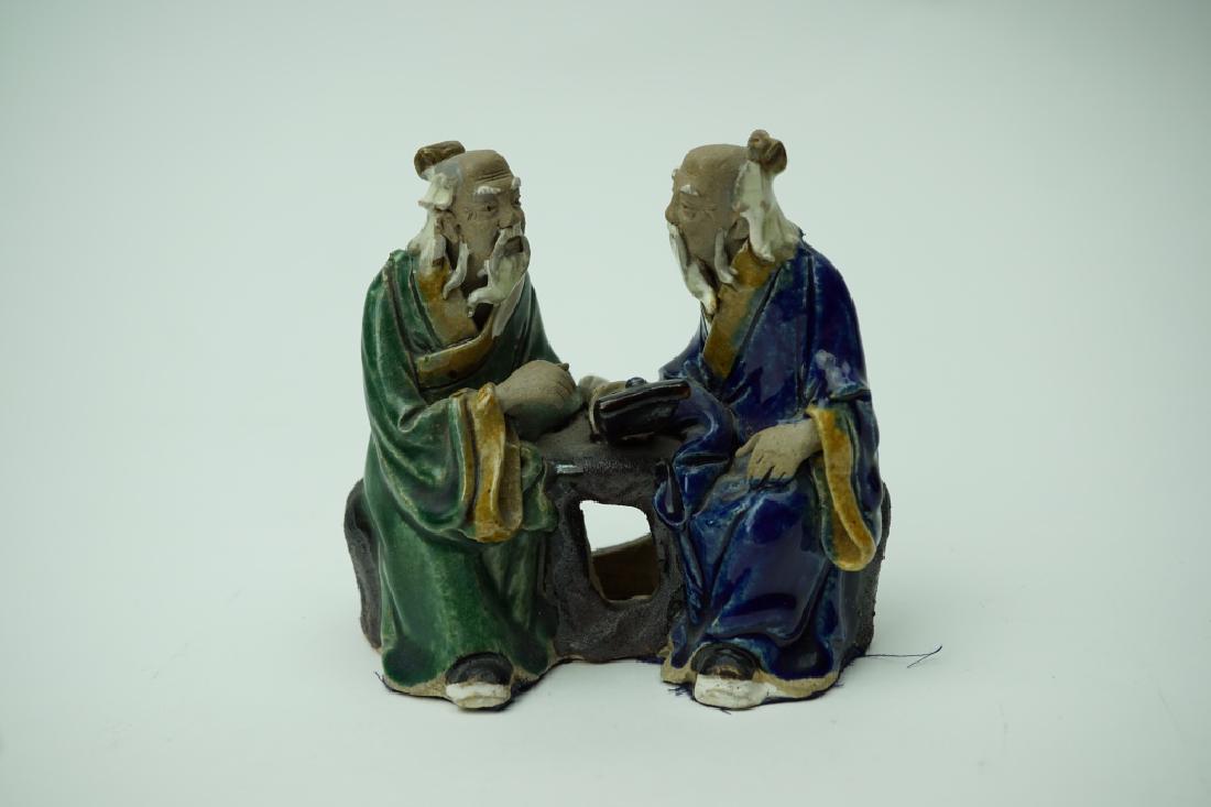 VINTAGE CHINESE MUDMAN FIGURE: VINTAGE CHINESE MUDMAN FIGURE Figure is stamped China on the inside. Statue depicts two old Asian ; Condition - Crazing to figures. ; Measures: 4.25"H x 4.25"W x 2.5"D