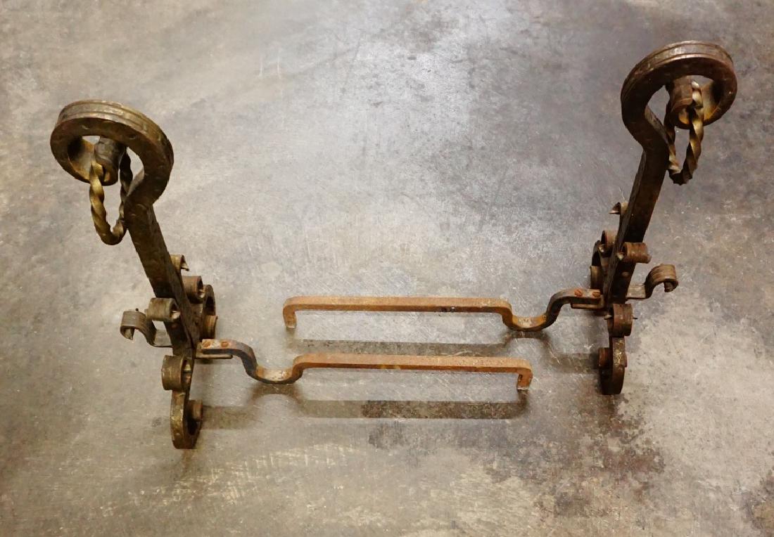 PAIR OF ANTIQUE WROUGHT IRON ANDIRONS: PAIR OF ANTIQUE WROUGHT IRON ANDIRONS With brass twist ring ; Measures: 21"H x 10"W x 23"L