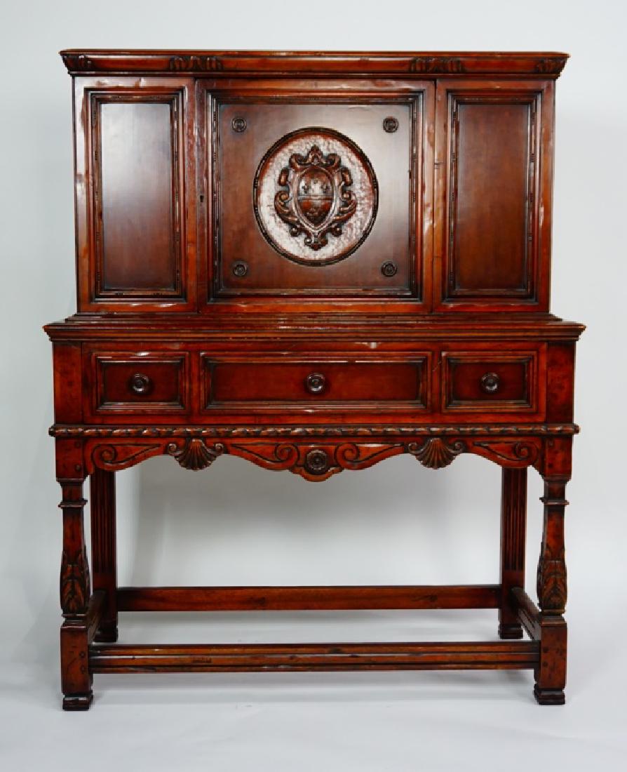 ANTIQUE ROBERT IRWIN COURT CUPBOARD: ANTIQUE ROBERT IRWIN COURT CUPBOARD Designed by J. Stuart Clingman. Single door cupboard with a carved shield crest panel over a single drawer and carved frame with shell carvings (signed J. Stuart Cl