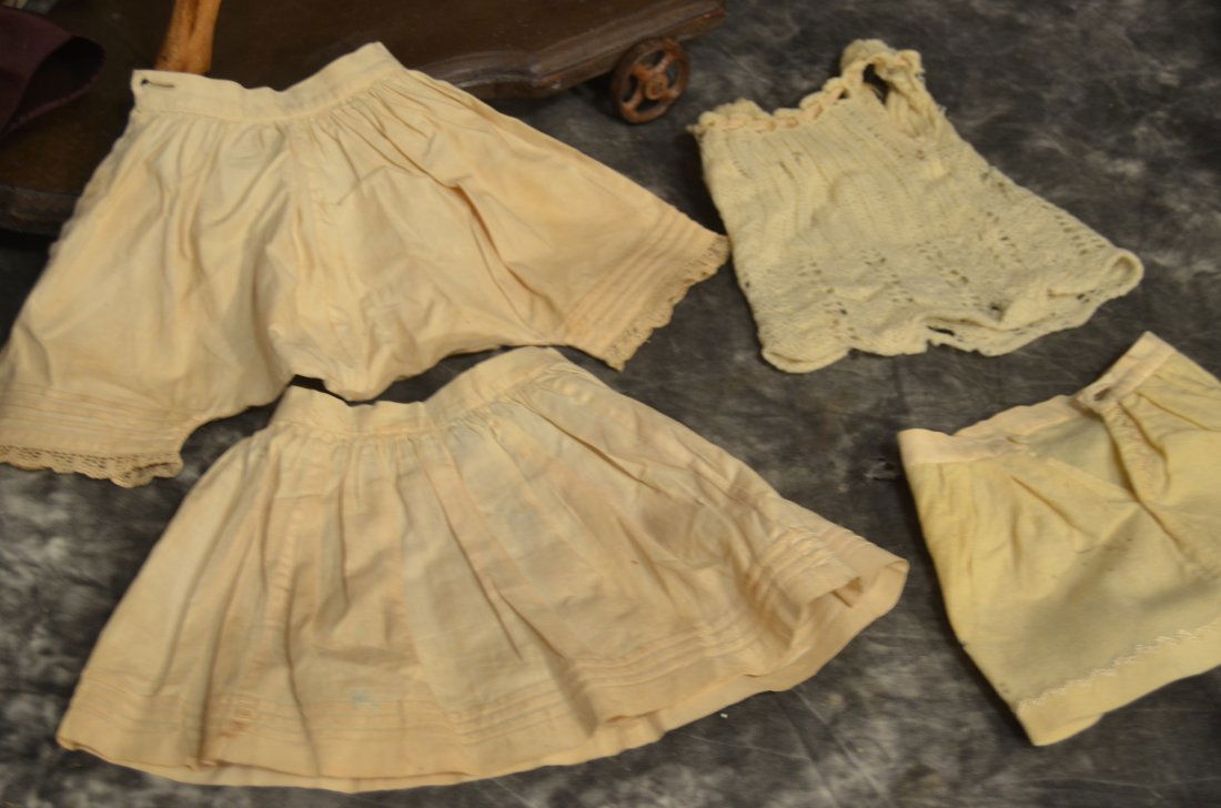 LOT OF 4 ANTIQUE/VINTAGE UNDER CLOTHING FOR JUMEAU: FEATURING 4 LOVELY ANTIQUE UNDER CLOTHING ITEMS FOR JUMEAU BEBE, SET CONSISTS OF A PAIR OF PANTALOONS, UNDER SKIRT, CROCHETED SLEEVELESS TOP AND SHORT UNDER SKIRT. SOME MAY HAVE SLIGHT IMPERFECTIONS A