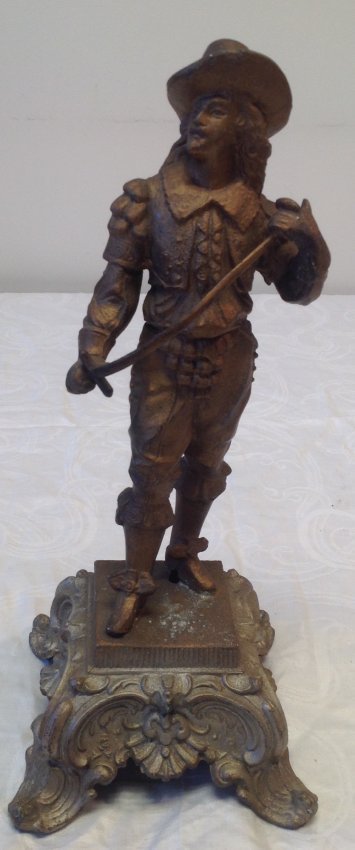 Gallant French Solider Statue 15 In. H: Gallant French Soldier with a sword statue. Material : White metal in gilt. Measurement approximate: 15 In. H. Shipping cost: $30 excluding Hawaii, Alaska and California.