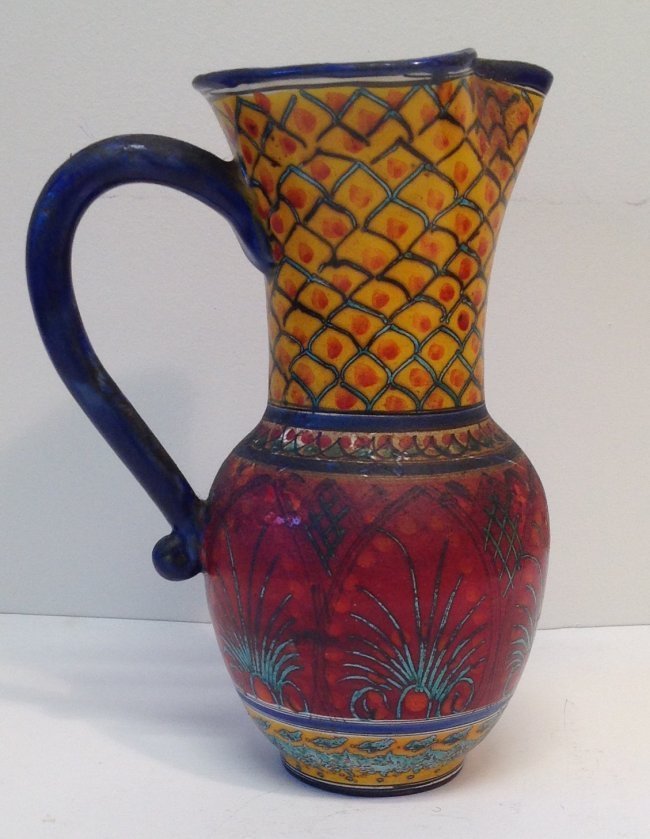 Signed Multi - Color Water Pitcher- Late 20th Century: Description: Signed vintage multi color Water vase/ Pitcher from the turn of the 20th Century.Material: Item is metal painted pottery style in vast colors. Measurement approximate: 9.5 tall x 5 Wide r