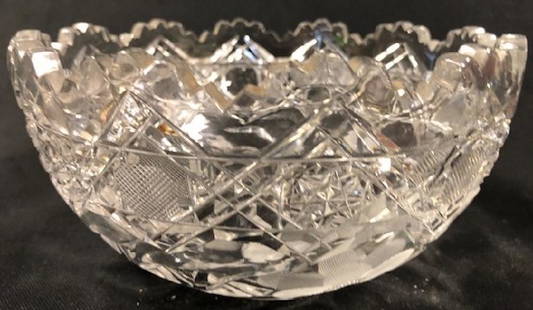 Beautiful Bliekristall Lead Crystal Bowl: Description: Beautiful lead crystal bowl from Bliekristall. Floral pattern on lower sides and underside; starburst etching along sides with scalloped top. Material: glass. Measurement: approximate