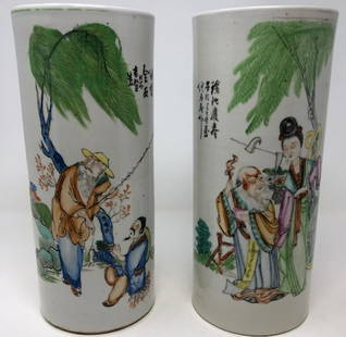 Splendid Asian Porcelain Vase Pair: Description: Twice as nice! Qing Dynasty style Asian porcelain vase pair, cylinder-shaped, depicting two happy interactions. Lovingly hand painted against a bisque background; small maker's mark on