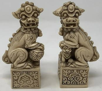 Foo Dog Stamp Pair: Description: Cunningly carved pair of foo dog stamps in resin. Great detail and personality. Material: resin. Measurement: approximate (each) 4"h x 1.5"w (INCHES0. Shipping: $15; different rate for