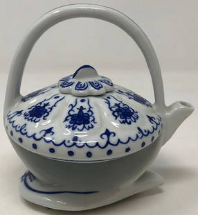 Delightful Art Deco-Style Tiny Teapot: Description: Delightful, diminutive porcelain teapot, Qing Dynasty-style. Daintily decorated in traditional blue over white porcelain with a lovely high glaze. Attached handle; removable cover with a