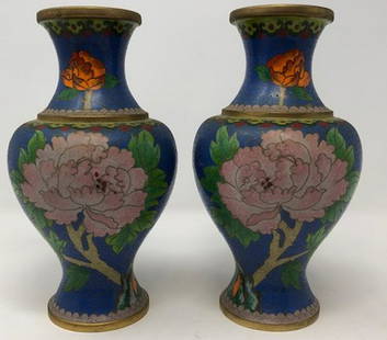 CloisonnÃ© Vase Pair: Description: Twin cloisonnÃ© over brass antique vase pair. Decorated with delicate peach, orange and green florals against a striking blue background; perfectly sized for display. Material: