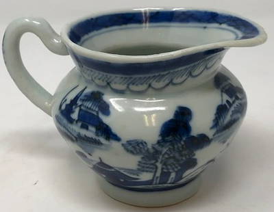 Qing Dynasty-Style Creamer: Description: Smaller-sized porcelain creamer; Qing dynasty-style. Hand painted with pretty traditional village scene in blue over white background; with handle and high glaze. Blue on interior lip.