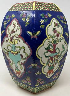 Unique Hexagon-shaped Vase: Description: Unique hexagon-shaped antique Asian porcelain vase. Floral and butterfly hand painted dÃ©cor in striking cobalt, pale blue, carmine and light green. This is a standout piece for your