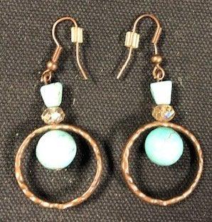 Copper Pierced Earrings: Description: Copper pierced ladies earrings with ear wire. Blue stones decorate these hanging earrings; nice retro appearance. Material: metal; stone. Measurement: approximate 2"l (INCHES). Shipping c