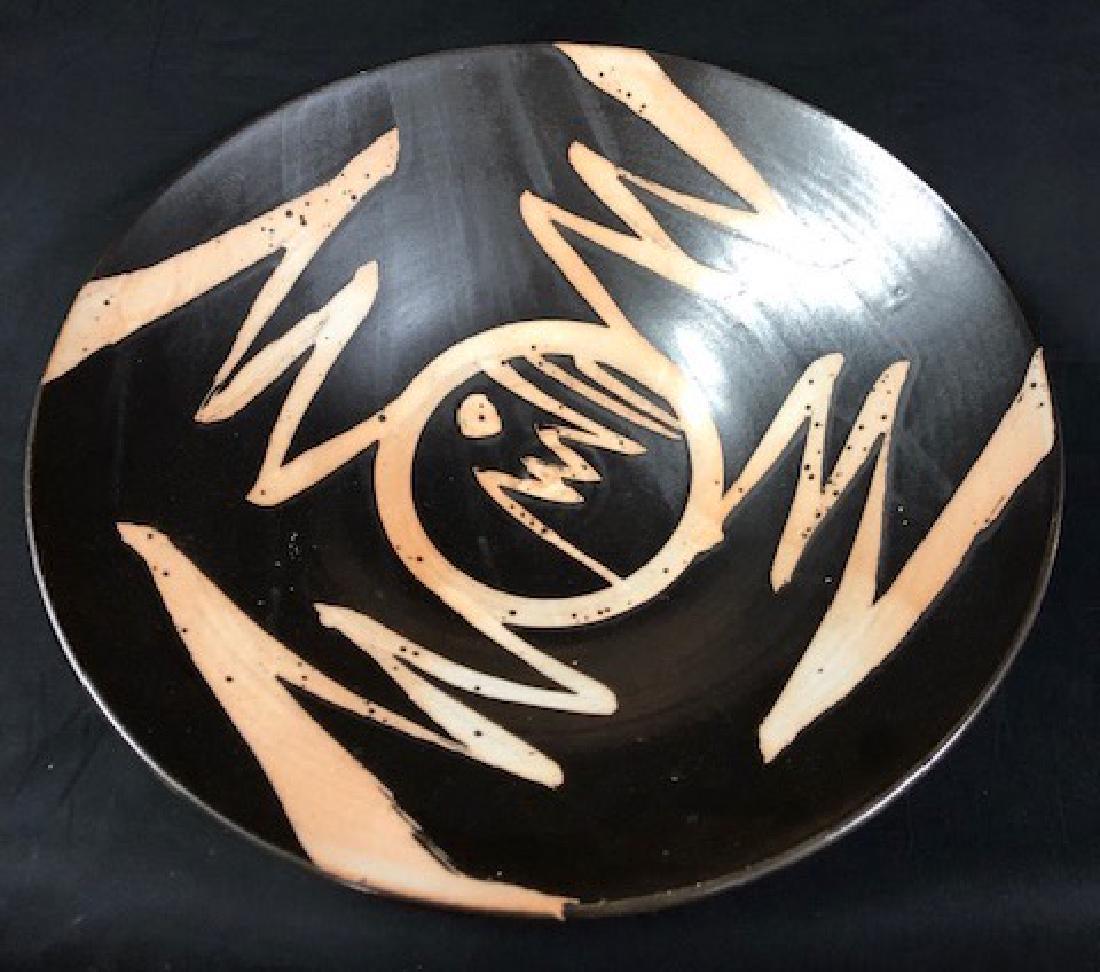 Retro Porcelain Signed Bowl: Description: Retro and wonderful large size porcelain bowl, signed. Fabulous black with abstract peach color accents. Signed on underside with large "W." Material: porcelain. Measurement: approximate