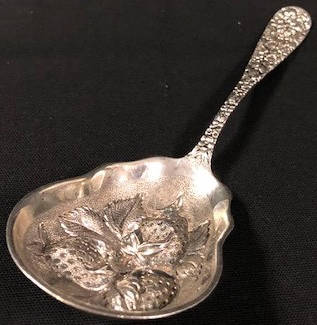 Sterling Steiff Repousse Relief Strawberry Berry Spoon: Description: Steiff Sterling Silver Repousse relief strawberry spoon. Estate item--gorgeously detailed, heavy sterling silver Stieff strawberry motif. Material: sterling silver. Measurement: approxima