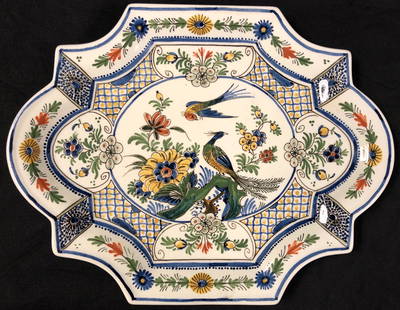 Signed Delft Polychrome Plate: Description: Signed Delft Polychrome plate, numbered 1702. Painted in a joyful array of peacocks and florals over a white background. Small platter or candy /dessert dish size in an unusual octagon