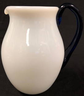 Luminous Vintage Opalescent Glass Pitcher: Description: Luminous vintage opalescent glass water pitcher with cobalt blue glass handle. European provenance. Signed on underside; slight chips on very bottom; no defects on body. Splendid