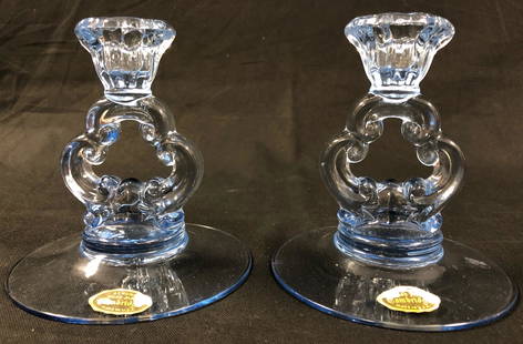 Cambridge Moonlight Blue Glass Candlesticks: Description: Graceful pair of Moonlight Blue Glass Candlesticks from Cambridge, hand made in the U.S. Original labels still affixed to base. Material: glass. Measurement: approximate 5.50" (INCHES). S