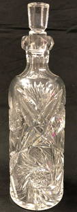 Lead Crystal Vintage Decanter: Description: Fabulous cut lead crystal decanter with stopper. Unusual slender shape and beautiful sunburst pattern. Baccarat-style, maker's mark not identifiable. Material: lead crystal. Measurement: