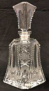 Stylish Lead Crystal Decanter: Description: Stylish and handsome spirit decanter in cut lead crystal with stopper. Etched with sunburst pattern, attractive, v-shaped bottom. Material: lead crystal. Measurement: approximate 10.75"