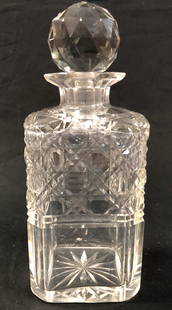 Antique 7.50" Cut Glass Spirit Decanter: Description: Handsome square body cut glass spirit decanter with glorious faceted stopper (possibly not original). Etching near mouth of decanter; sunburst pattern on bottom. Perfectly sized for