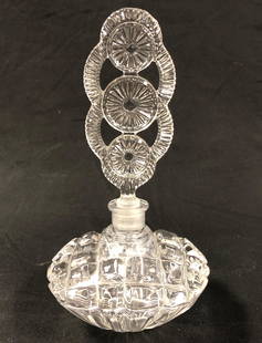 Lalique-Style Perfume Bottle with Stopper: Description: Lalique-style vintage perfume bottle with elaborate stopper. Lovely v-shaped base with crosshatch etching. Material: glass. Measurement: approximate 8" (INCHES). Shipping: $30: