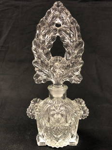 Bewitching Antique Perfume Bottle: Description: Bewitching Antique perfume bottle with a very distinctive shape and floral relief etching pattern. Topped with a fabulous Lalique-style stopper (not original). Material: glass.