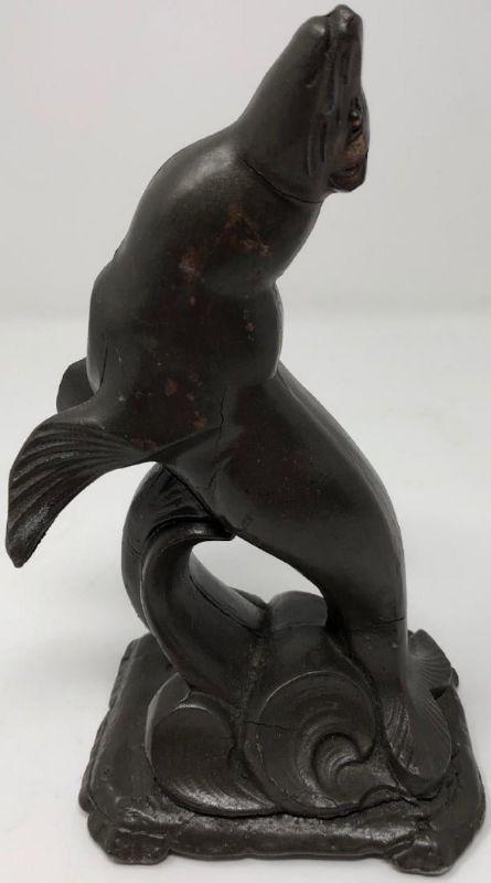 Le Verrier-Style Art Deco Seal: Description: Art deco Max Le Verrier-style joyful heavy metal/spelter cast sculpture of a seal breaking the water. Slight crack at tail. Measurement: approximate 9"h x 4"w (INCHES). Shipping cost: $17