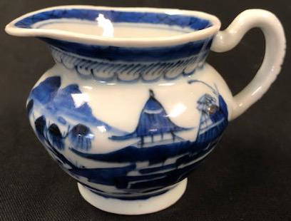 Petite Qing Dynasty Style Porcelain Pitcher: Description: Pretty and petite Qing Dynasty style porcelain pitcher in traditional blue and white. Nicely sized to grace any collection. Material: porcelain. Measurement: approximate 3.5"h (INCHES).