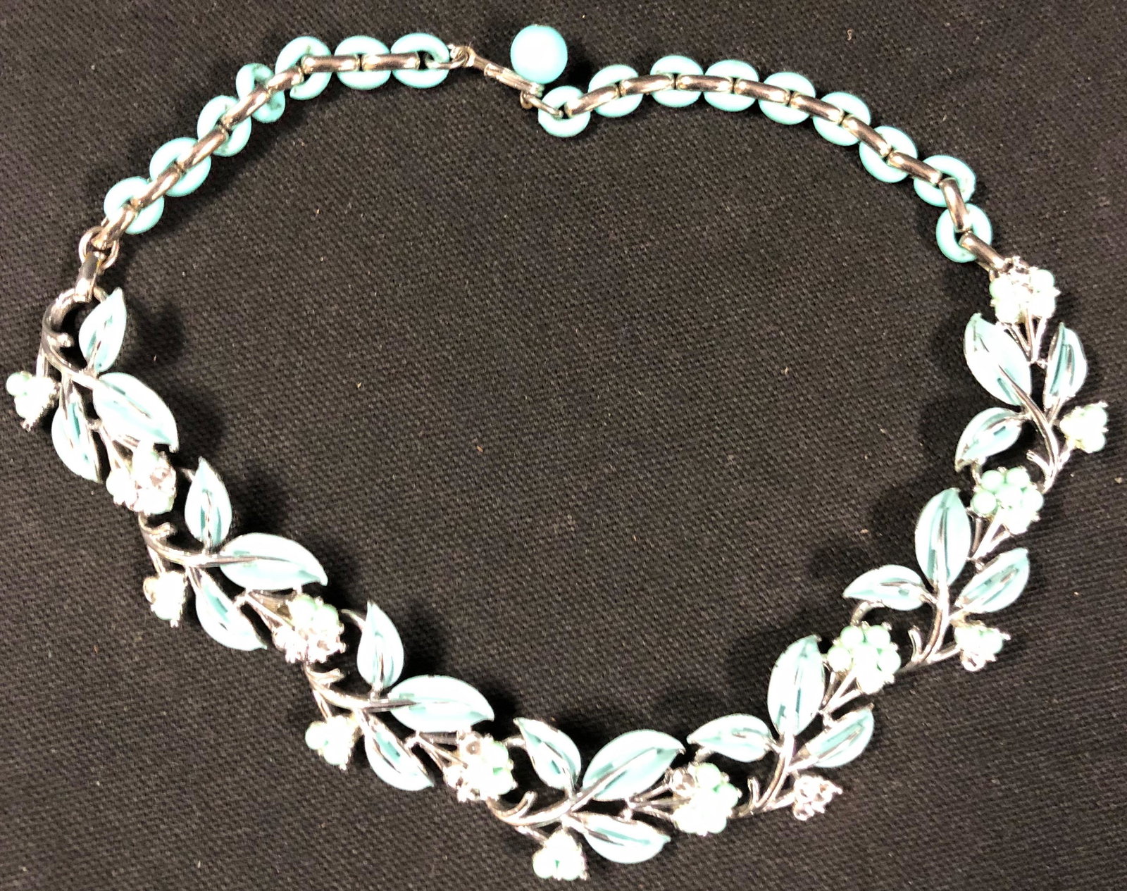Retro Floral Choker-Style Necklace: Description: Beautiful aqua blue floral choker style necklace. Set in silver tone metal. Material: metal; enamel. Measurement: approximate 14" (INCHES). Shipping: $12; different rate to Alaska, Califo