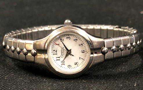 Caravelle by Bulova Vintage Ladies Watch: Description: Caravelle by Bulova vintage ladies watch, petite and perfect. Very feminine design of mesh bad, small, round face with second hand. Serial number C869690. Material: metal; glass. Measurem