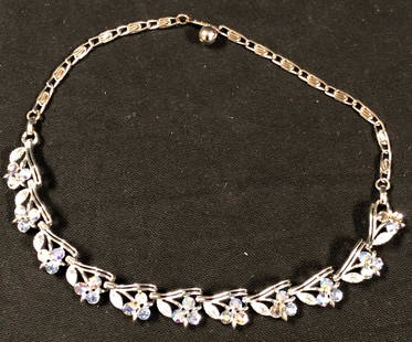 Resplendent Crystal and Silver Metal Choker-Style: Description: Elegant and eye-catching. Splendid vintage silver metal and crystal choker-style floral necklace with extender. Material: metal; glass. Measurement: approximate 17" (INCHES). Shipping: