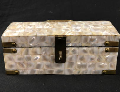 Vintage Mother of Pearl Jewelry Box: Description: Vintage Jewelry Box with mother of pearl overlay and brass fittings. Glamorous and unusual; lined in black velvet. Material: mother of pearl overlay; wood; velvet; brass. Measurement: app