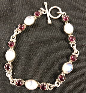 Beautiful Sterling Silver Garnet & Moonstone Bracelet: Description: Beautiful Sterling Silver bracelet set with garnets and luminous moonstones. Material: Sterling silver, semi-precious stones. Measurement approximate 7" (INCHES). Shipping: $12.00 within