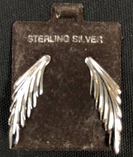 Exquisite Sterling Silver Pierced Earrings: Description: Exquisite Sterling Silver wing-shaped pierced earrings. Delicate and delightful. Material: Sterling silver. Measurement approximate 1.75" (INCHES). Shipping: $12.00 within the United