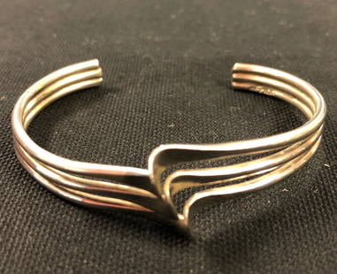 Beautiful Silver-Style Bracelet: Description: Beautiful silver-style cuff modern-style Bracelet. Material: Silver tone metal, possibly Mexican silver. Measurement approximate 7" (INCHES). Shipping: $12.00 within the United States