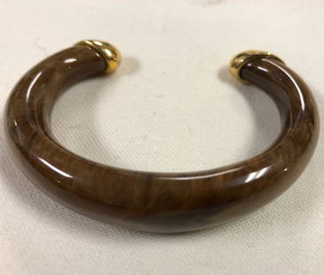 Vintage Stunning Brown Bakelite Bangle Bracelet: Description: Stunning, very unique Brown Bakelite Bangle Bracelet with 14k over sterling silver tips. Item is approximately 90 Yrs. old. WeightÂ… Measurement approximate 8" (INCHES). Shipping: