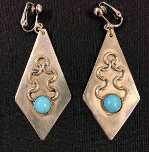 Vintage Sterling Silver Clip Earrings w/Turquoise: Description: Vintage exquisite Sterling Silver clip on earrings set with turquoise. Graceful and elegant drop earrings. Material: Sterling silver/ turquoise. Measurement approximate 3" (INCHES). Shipp