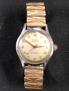 Vintage 1940 Helios Mens 17 Jewel Watch/ Works: Description: Vintage 1940's Helios Mens Wrist Watch. 17 Jewel and Waterproof. Material: Gold tone metallic wrist band. Shipping: $12.00 within the United States only.