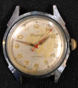 Vintage Swiss Made "Picard" Men: Description: Vintage Swiss Made "Picard" Men's watch. No band; watch only. Material: metallic. Shipping: $12.00 within the United States only.