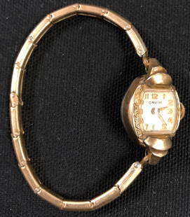Vintage Orvin Gold filled Ladies Swiss Watch: Vintage ORVIN Gold Filled Swiss Watch with a stretch twist chain band. Shipping: $12.00 within the United States only.