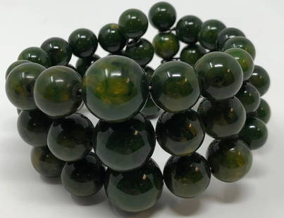 Dark Green Agate Beaded Bypass Bracelet: Description: Gorgeous dark green beaded bypass bracelet with smooth, natural agate stones strung on wire. Bypass style. Material: natural stone. Measurement: approximate size 7.50. Shipping: $15;